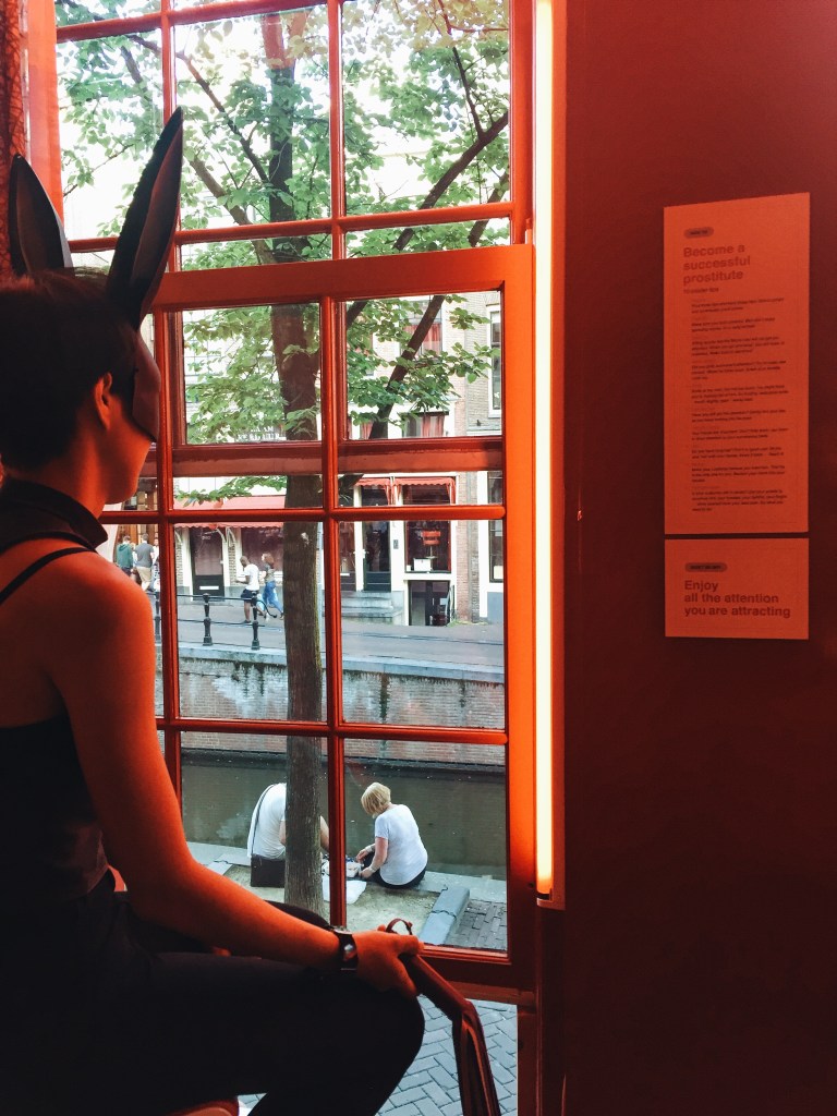 A tourist poses as a prostitute.